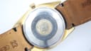 Close-up of the stainless steel case back of the Royce Leadership 1100, showing 'Swiss Made' and 'Waterproof' engravings, and the 'R' logo.