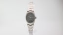 Front view of Tissot Stylist women's watch with grey dial and integrated steel bracelet.