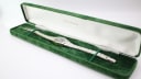 Tissot Stylist watch displayed in a generic green presentation box.