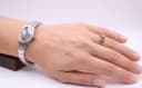 Watch worn on a female wrist, showcasing its elegant proportions and retro style.