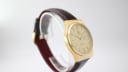 Further angled view of the Tissot Seastar Quartz, showcasing the elegant lines of its gold case and the rich brown leather strap.