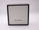Top view of the closed original black Gucci presentation box.