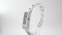 Side profile of the Gucci 110 watch, highlighting the polished silver-tone case, crown, and integrated steel bracelet.