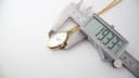 Digital caliper measuring the case diameter of the Seiko pendant watch at 19.33mm.