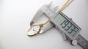 Digital caliper measuring the case width of the Seiko pendant watch at 19.33mm.