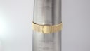 Gold tone mesh bracelet displayed on a wrist sizing gauge, showing an approximate wrist fit of 18.3cm.