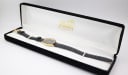 Top-down view of the Amara watch positioned within a black presentation box.