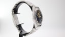 Angled side view of the watch, showing the brushed finish of the case and bracelet.