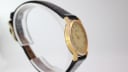 Side profile view of the Rodania 18711 watch case, highlighting the wear and vintage character of the gold plating.