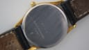 Close-up of the Rodania 18711 stainless steel case back, engraved with model number, water resistance, and showing strap wear.