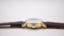 Side profile view of the Tissot Seastar case, showing the signed crown with the Tissot 'T' logo.