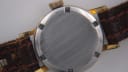 Close-up of the stainless steel case back of the Tissot Seastar, showing visible scratches.