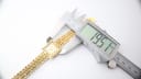 Digital caliper measuring the case diameter of the Caravelle N.1 watch, displaying 19.51mm.