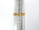 Close-up of the gold tone bracelet on a wrist sizing gauge, indicating a circumference of approximately 15cm.