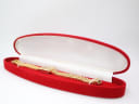 The Caravelle N.1 watch laid inside a red velvet presentation box with white interior lining.