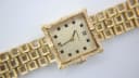 Angled close-up of the Caravelle N.1 dial and the intricate textured gold tone bracelet.