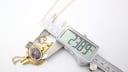 Digital caliper measuring the Oris pendant watch case, showing a width of 23.89mm.