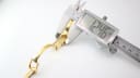 Digital caliper measuring the width of the Gucci 1500L watch case, showing a reading of 12.46mm.