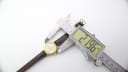 Digital caliper measuring the case diameter of the Slava watch, showing a reading of 21.96mm.