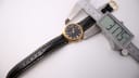 Digital caliper measuring the case diameter of the Ingersoll watch at 37.75mm.