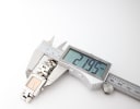 Digital caliper measuring the Tissot L730K case diameter at 21.95mm, confirming its compact size.