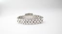 Full view of the Tissot L730K watch from the back, showing the entire stainless steel bracelet laid flat.