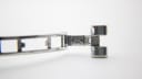 Close-up of the stainless steel bracelet clasp, engraved with 'Stainless Steel L730.1100'.