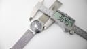 Second view of the digital caliper measuring the watch case diameter at 36.45mm.