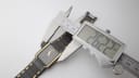 Digital caliper measuring the case width of the Seiko watch, showing a reading of 26.22mm.