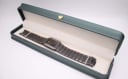 The Seiko watch presented in a green LWM display box.