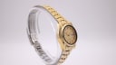 Opposite angled side view of the vintage gold-tone Seiko automatic watch, highlighting the case shape and crown.