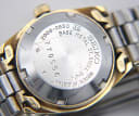 Close-up of the stainless steel case back with model number 2906-0850, serial number 770556, and water resistant engraving.