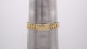 The gold-tone steel bracelet closed on a wrist sizing gauge, showing a wrist circumference of approximately 170mm / 17cm.