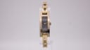 Gucci 3900 L watch with black dial and two-tone case, 2000s