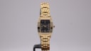 Krug-Baümen watch with black dial and gold case, 1990s