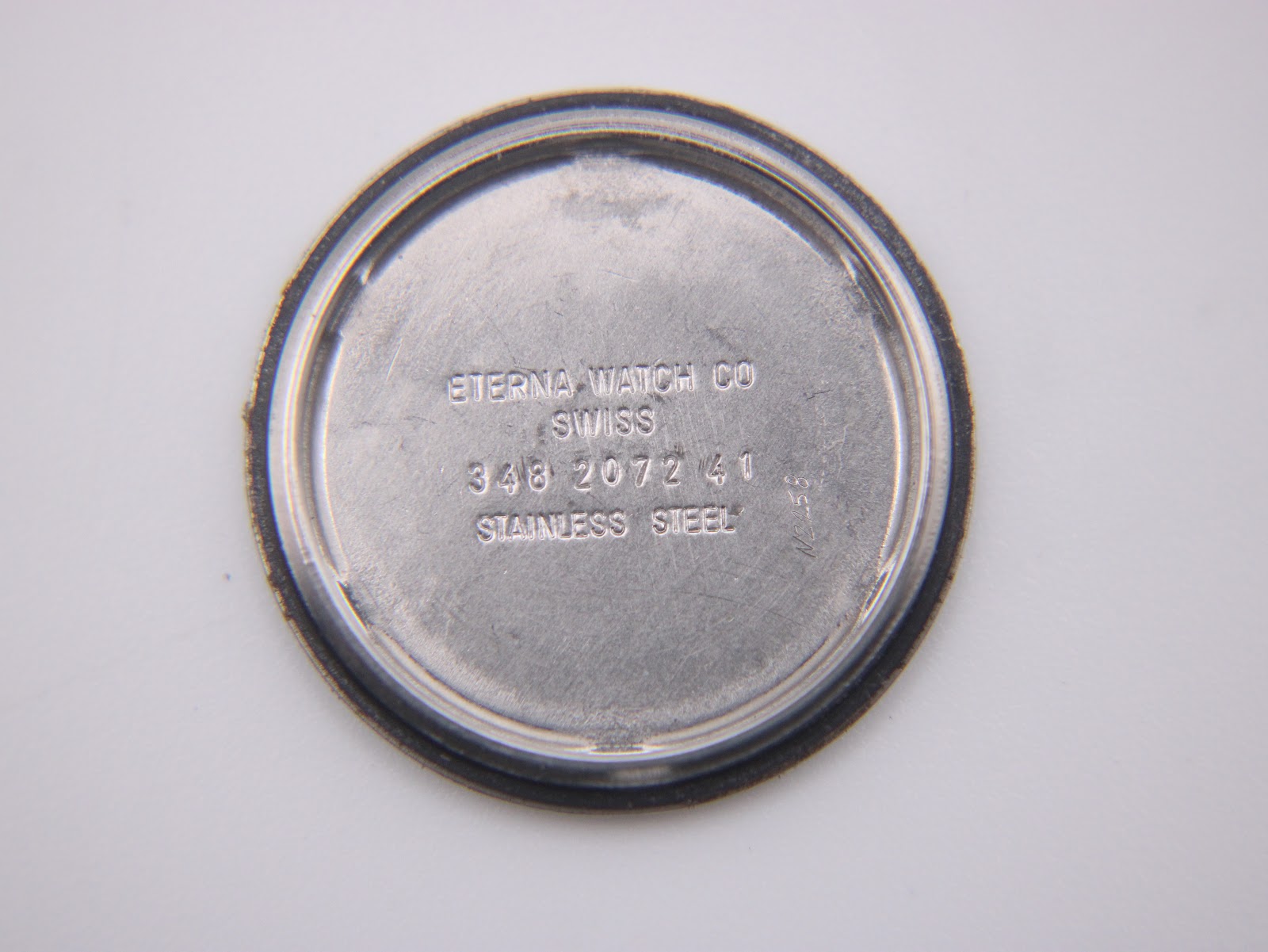 Close-up of the watch crown, showing its textured finish.