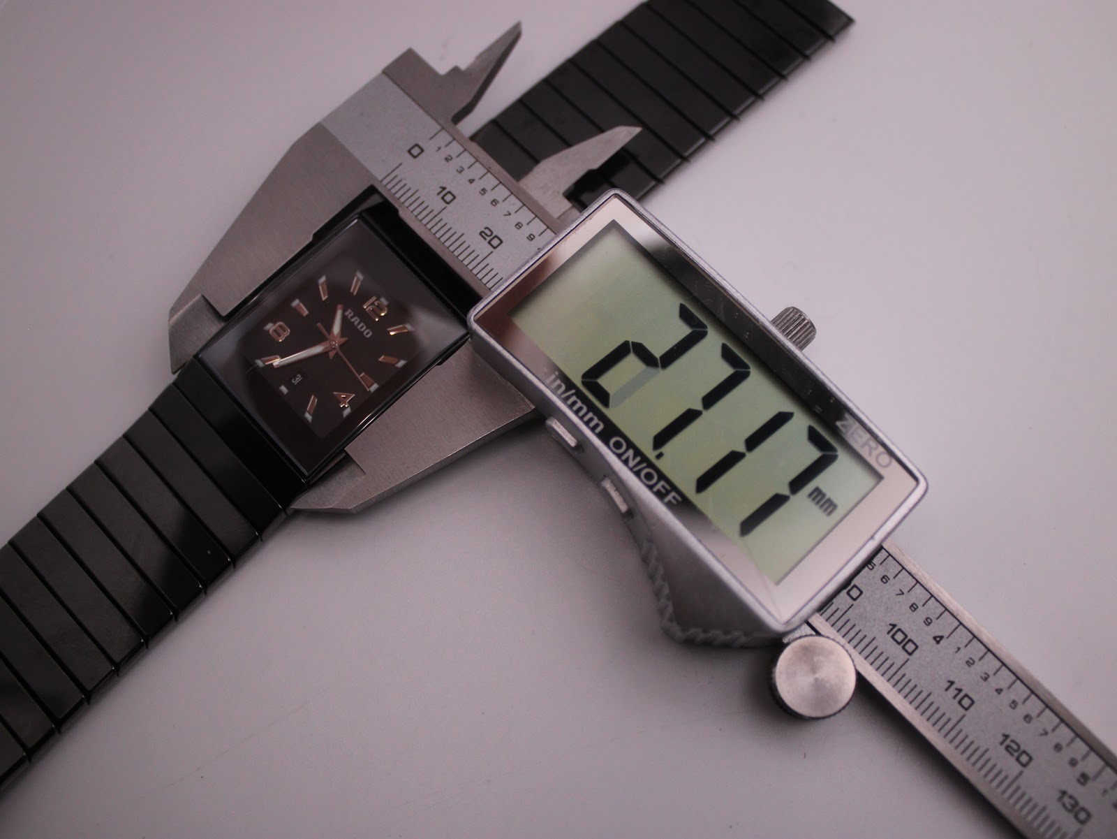 Digital caliper measuring the case width of the Rado Diastar, displaying an exact measurement of 27.17mm.