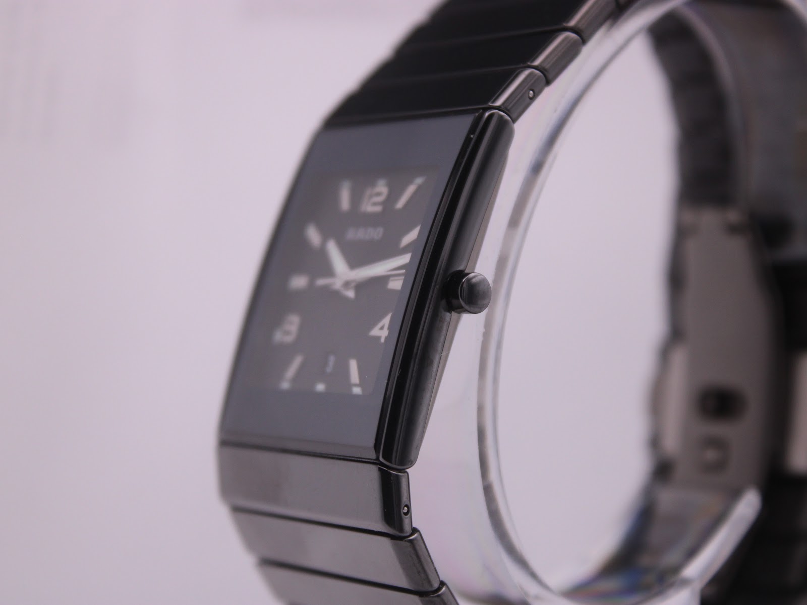 Close-up side view of the Rado Diastar, highlighting the sleek black ceramic case, crown, and integrated bracelet design.