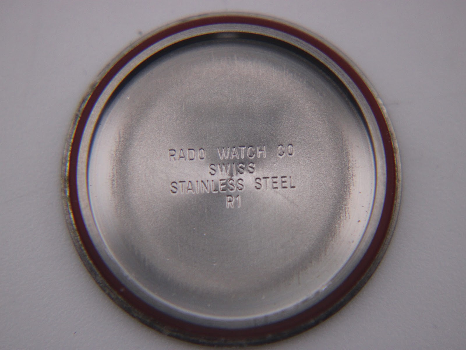 Interior of the case back of the Rado Diastar, showing "RADO WATCH CO SWISS STAINLESS STEEL R1" engraving.