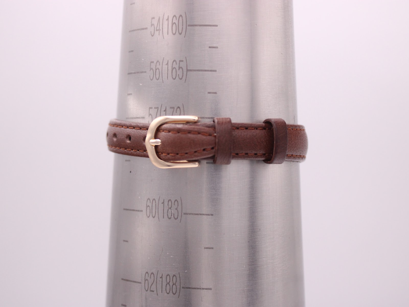 Longines watch strap on a wrist sizing cone, buckled at approximately 172mm circumference.
