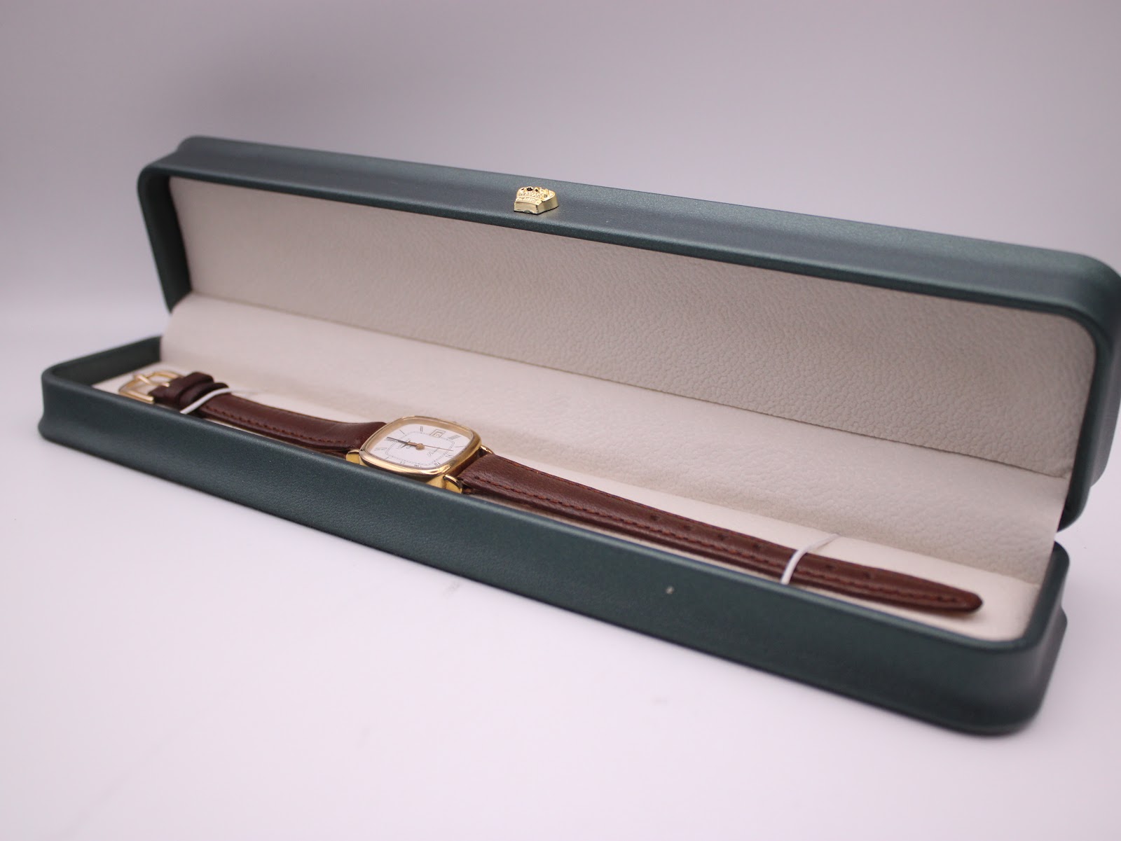 Longines Presence watch neatly presented in its original dark green rectangular watch box with cream interior.