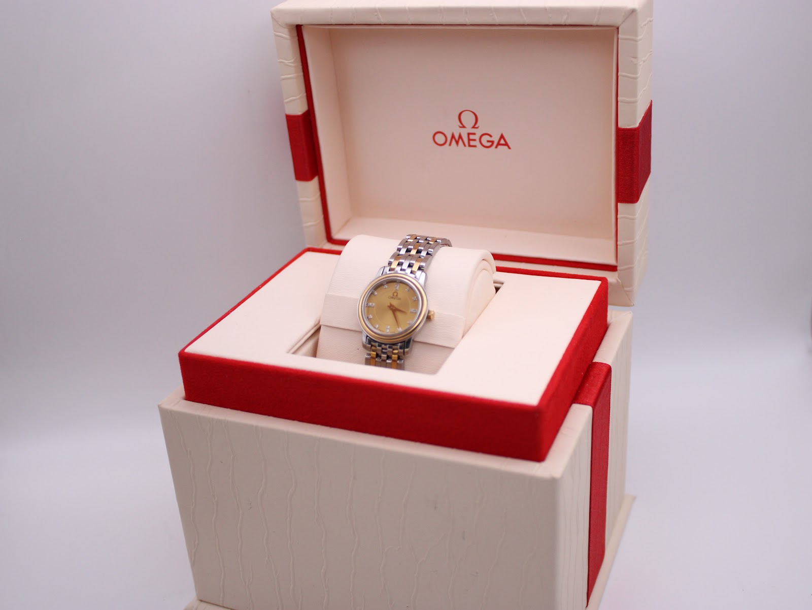 The Omega 595.1055 watch presented inside its original Omega presentation box.