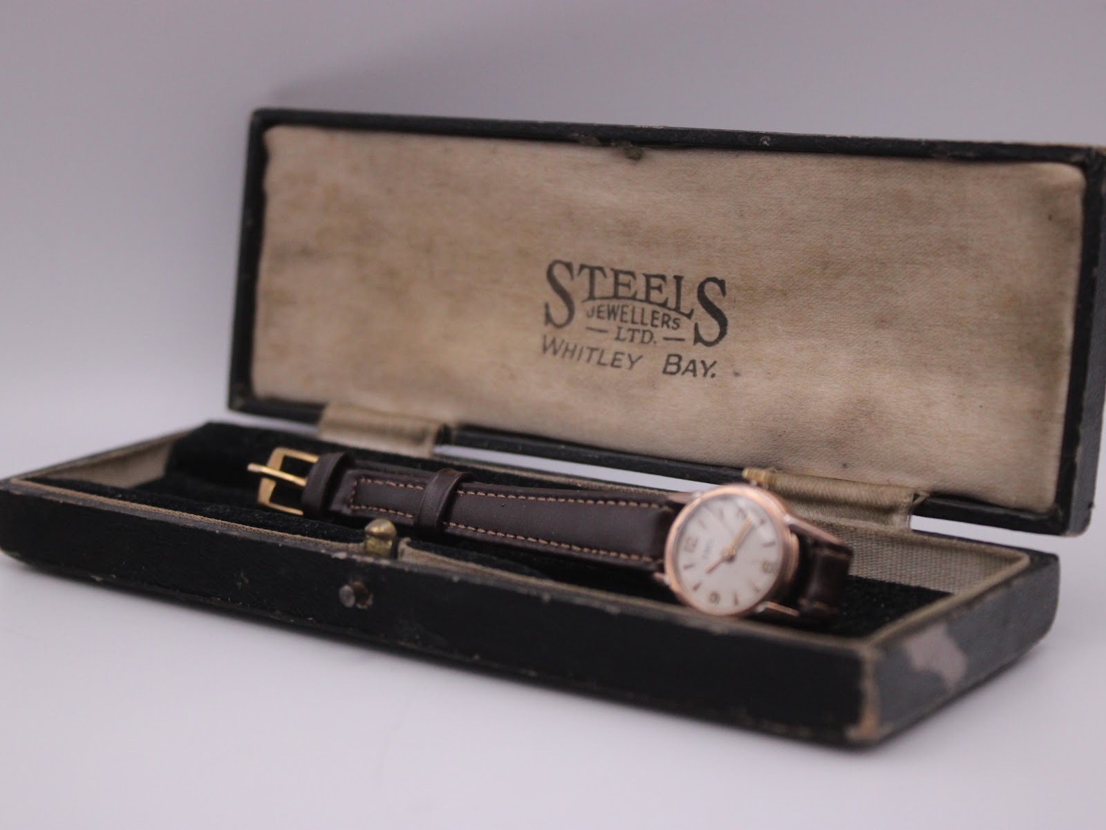 The EBEL watch nestled inside its original black box, showing the 'STEELS JEWELLERS LTD. WHITLEY BAY.' branding on the silk lining.