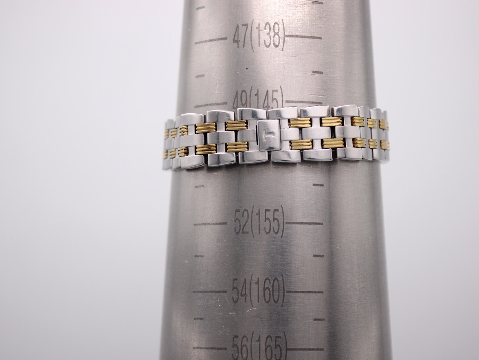 The Tissot Ballade bracelet displayed on a wrist sizing cone, indicating a maximum wrist size of approximately 150mm.