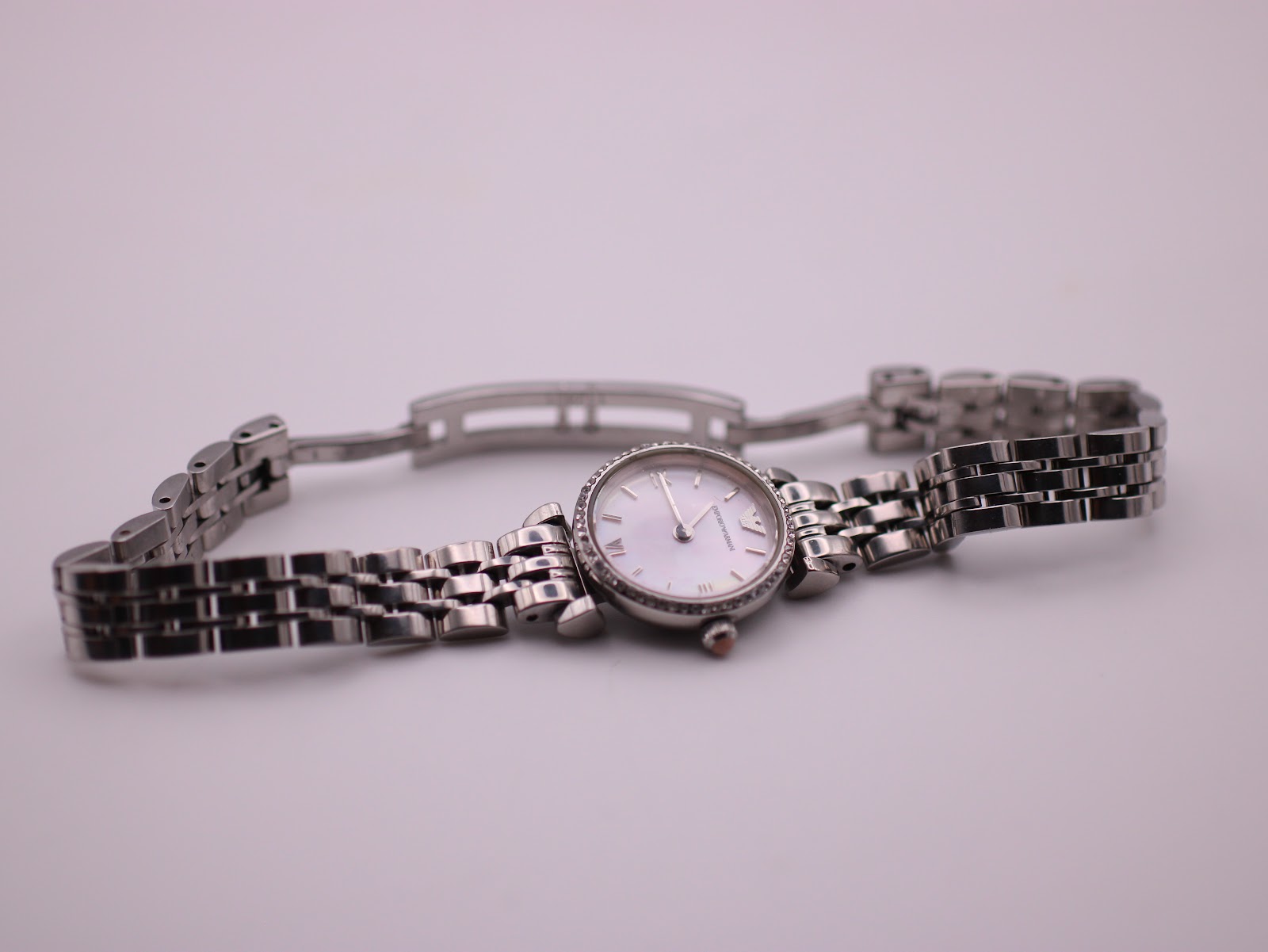 Overhead view of the Emporio Armani AR-1781 watch with its stainless steel multi-link bracelet laid flat and open.