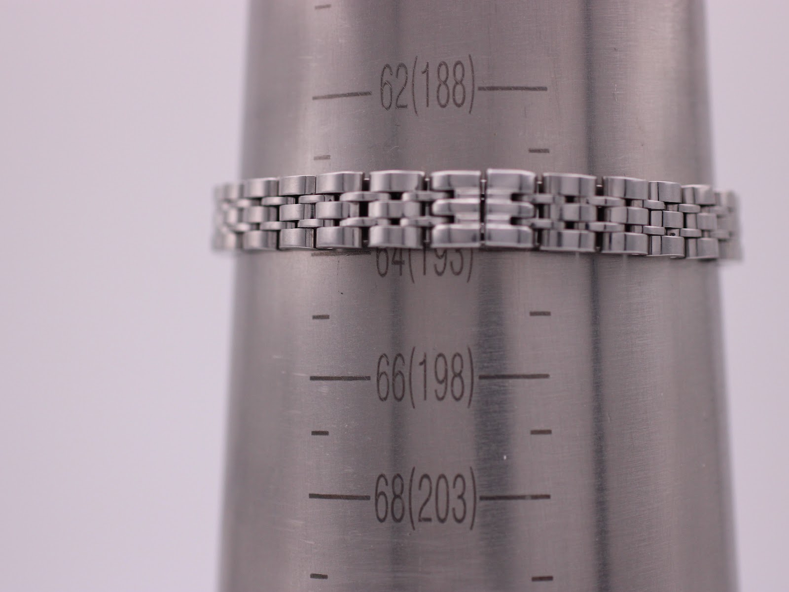 The Emporio Armani AR-1781 steel bracelet on a wrist sizing gauge, showing a circumference of 188mm (18.8cm).