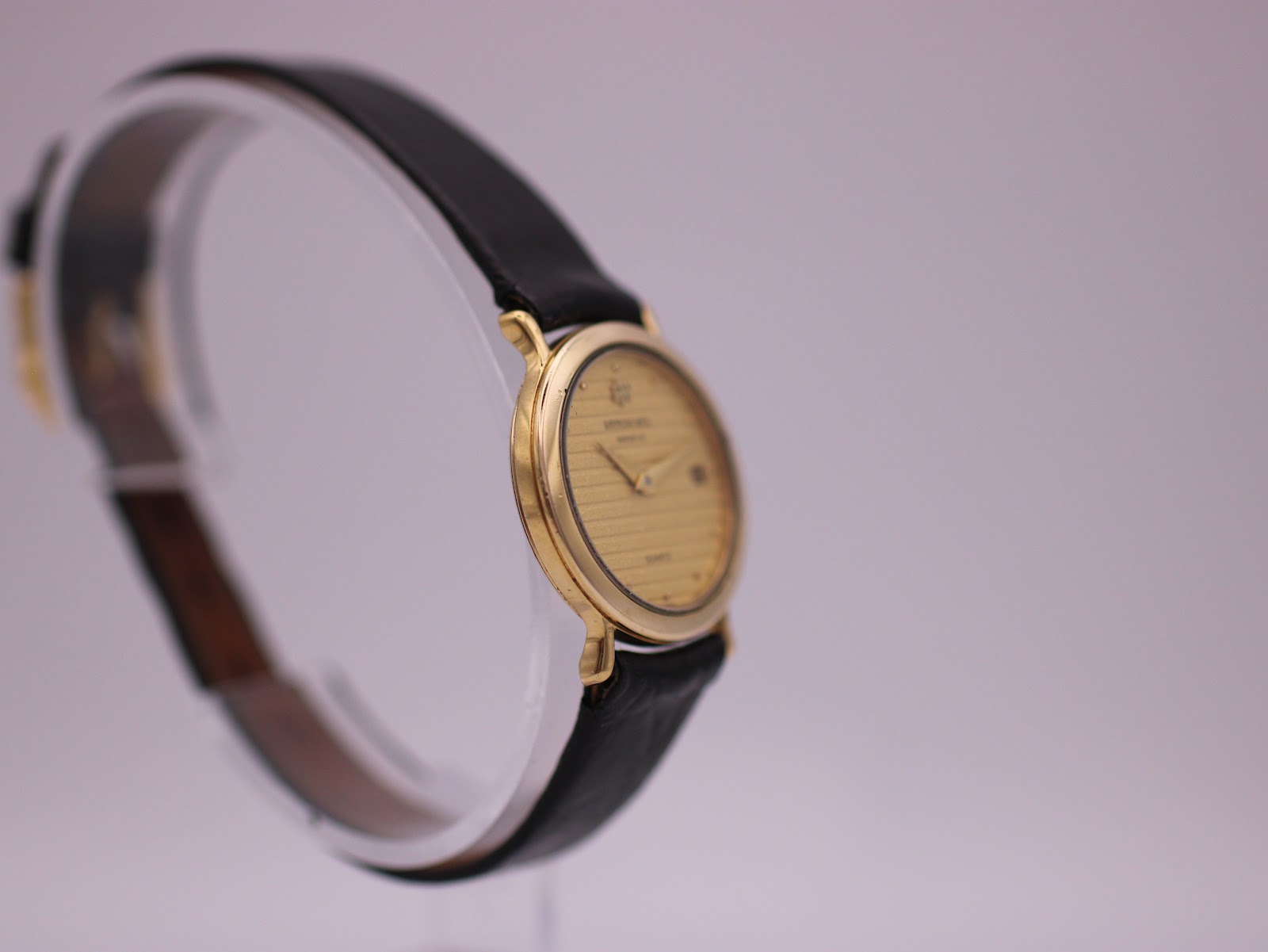 Another side angled view of the Raymond Weil 9920 watch, highlighting its slim case profile.