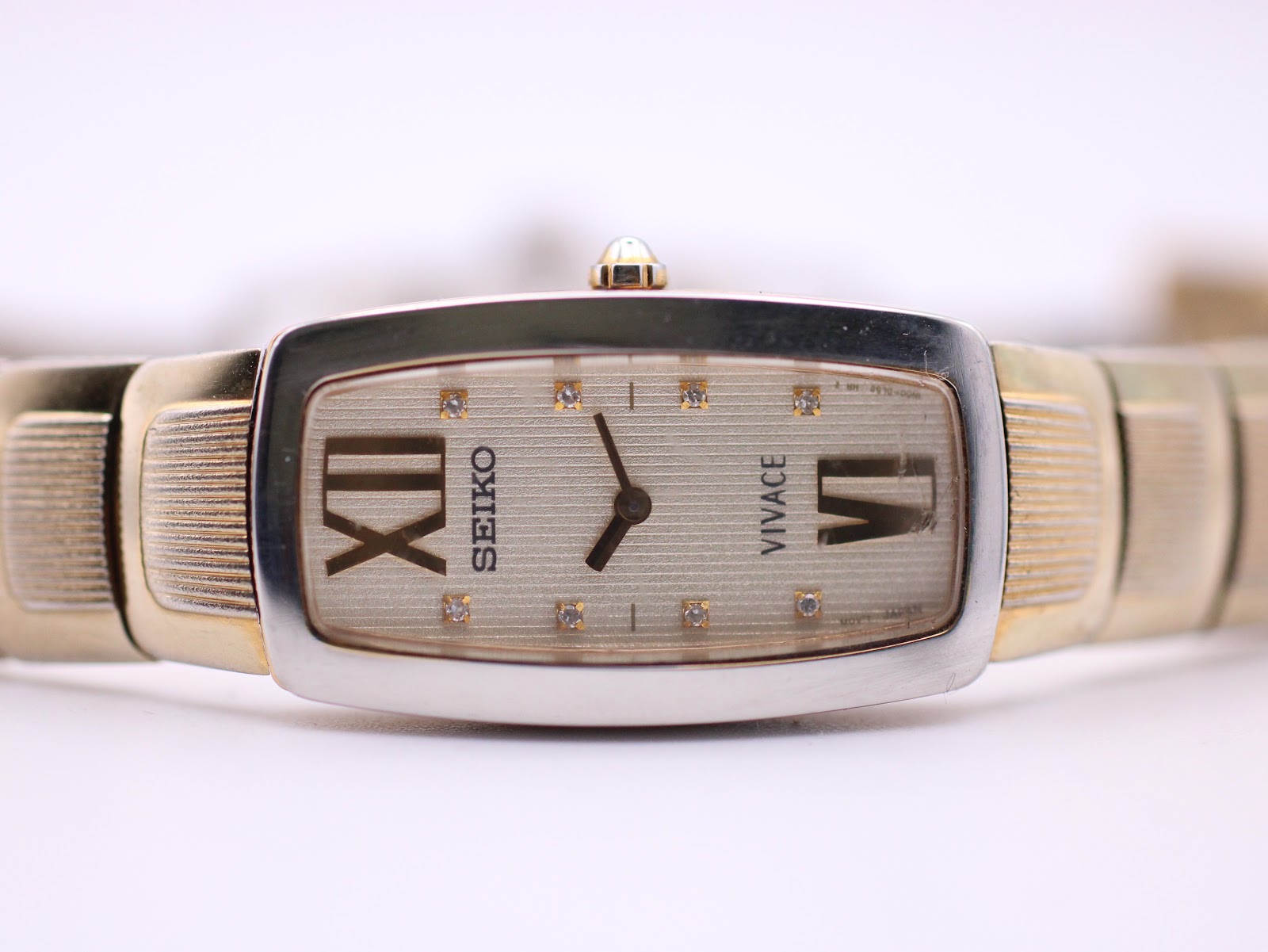 Another side-angle view of the Seiko Vivace watch, highlighting the rectangular case and the integrated bracelet.