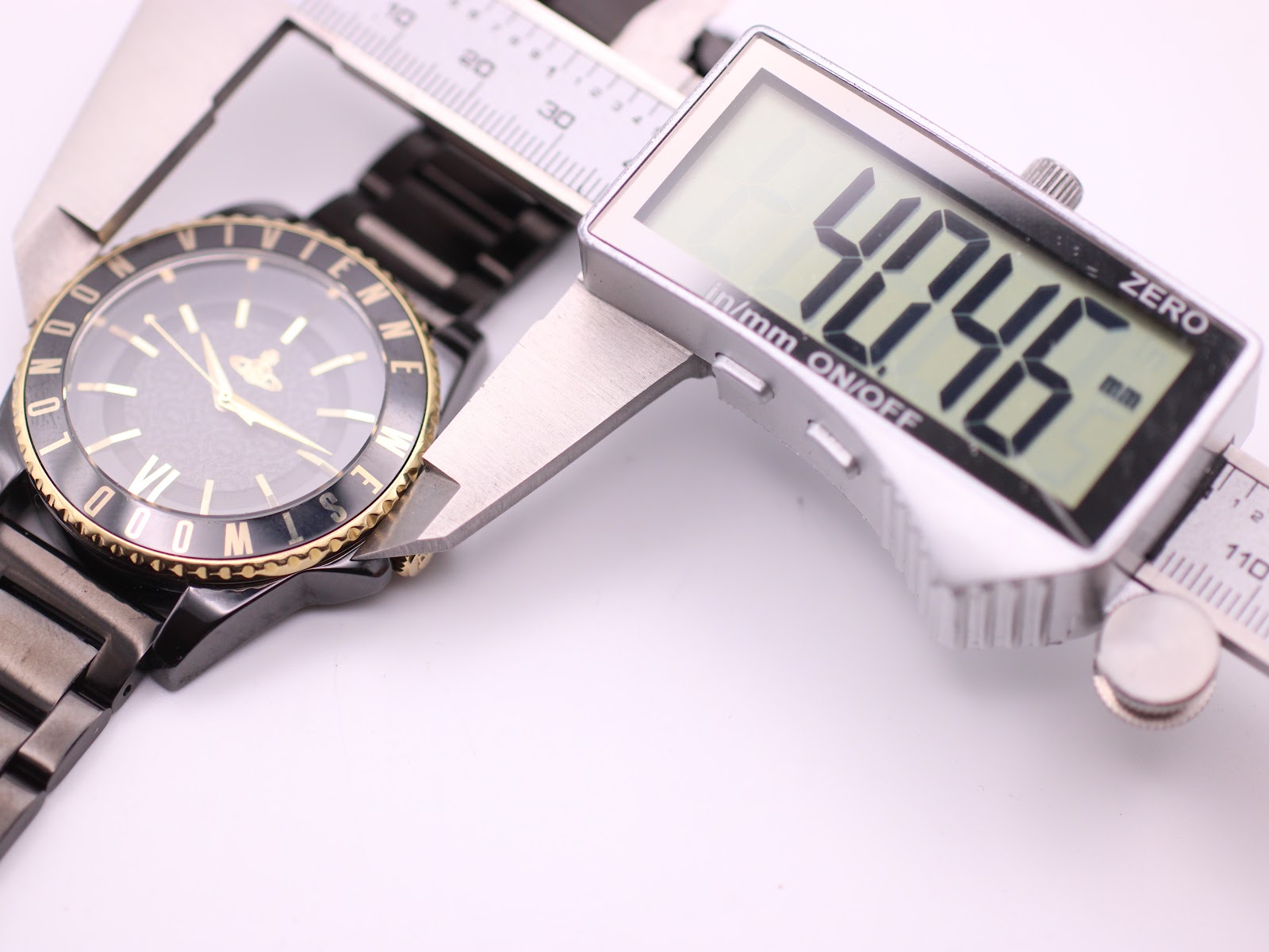 Digital caliper measuring the watch case diameter at 40.746mm.