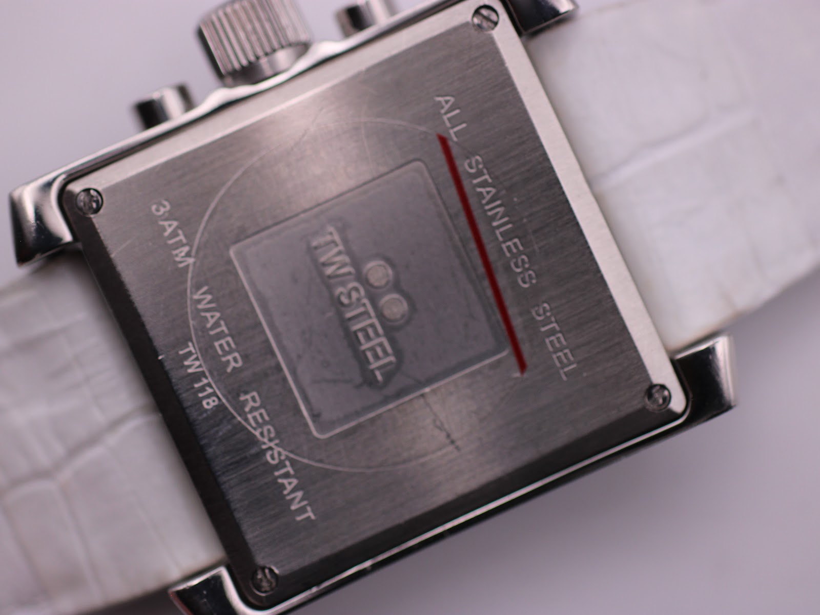 Case back view of the TW Steel TW 118, showing "All Stainless Steel", "3 ATM Water Resistant", and model number.